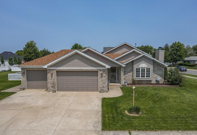 413 W Cook St, Manteno, IL 60950 - view of front facade featuring a garage, driveway, a front yard, a chimney, and brick siding