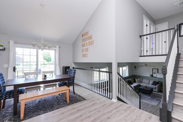 413 W Cook St, Manteno, IL 60950 - dining space featuring high vaulted ceiling, wood finished floors, and a chandelier