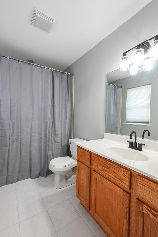 413 W Cook St, Manteno, IL 60950 - bathroom with tile patterned floors, toilet, and vanity