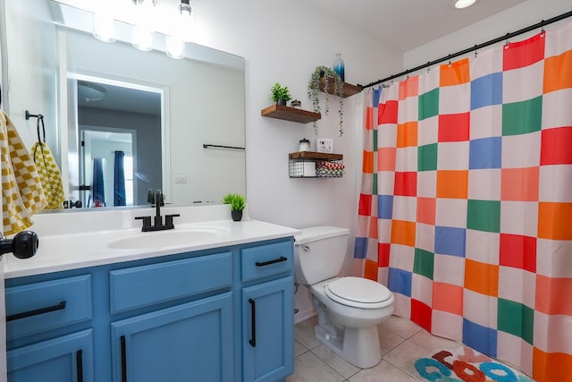 413 W Cook St, Manteno, IL 60950 - full bathroom featuring vanity, tile patterned floors, toilet, and a shower with shower curtain