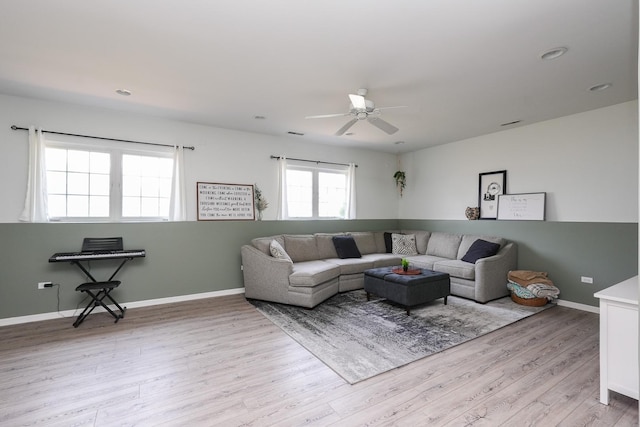 413 W Cook St, Manteno, IL 60950 - living area with light wood finished floors, a ceiling fan, and baseboards