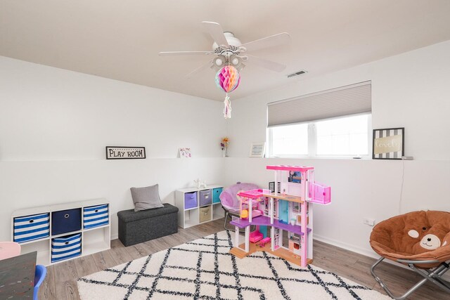 413 W Cook St, Manteno, IL 60950 - playroom with wood finished floors, ceiling fan, and baseboards