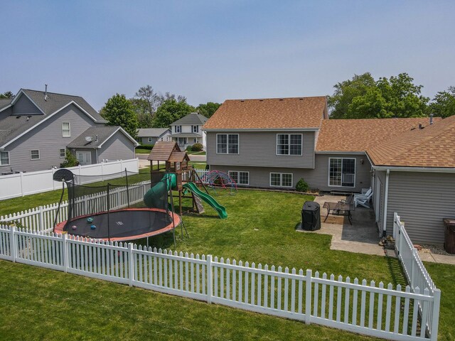 413 W Cook St, Manteno, IL 60950 - view of playground featuring a patio area, a trampoline, and a residential view