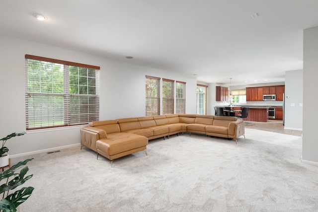 14605 Colonial Pkwy, Plainfield, IL 60544 - living area with light carpet, baseboards, and recessed lighting