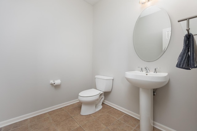 14605 Colonial Pkwy, Plainfield, IL 60544 - bathroom featuring toilet, baseboards, and tile patterned flooring