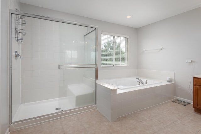 14605 Colonial Pkwy, Plainfield, IL 60544 - bathroom featuring vanity, a shower stall, a garden tub, and tile patterned floors