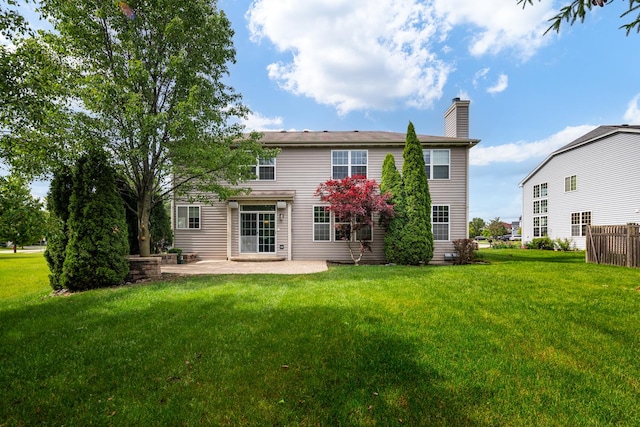 14605 Colonial Pkwy, Plainfield, IL 60544 - back of property featuring a patio area, a chimney, and a lawn