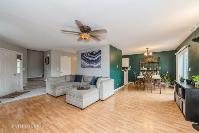 221 Wedgewood Cir, Lake In The Hills, IL 60156 - living area with light wood-type flooring, a chandelier, ceiling fan, and baseboards