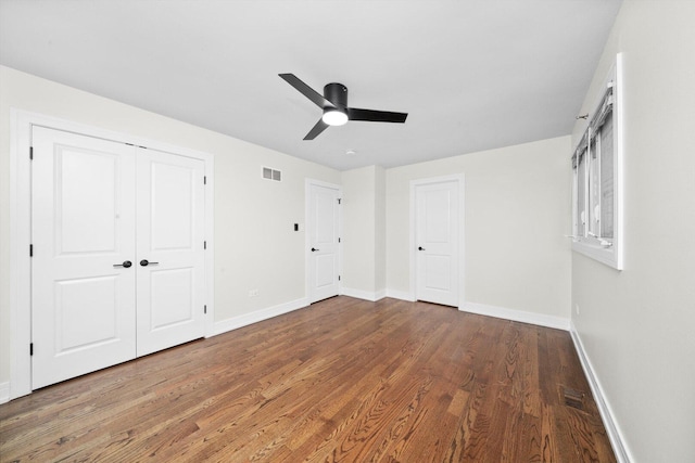 8300 S 79th Ct, Justice, IL 60458 - unfurnished bedroom featuring wood finished floors, baseboards, and a ceiling fan