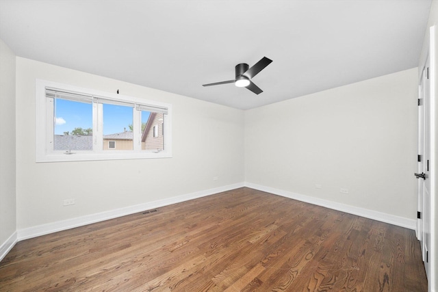 8300 S 79th Ct, Justice, IL 60458 - empty room featuring dark wood-type flooring, baseboards, and ceiling fan