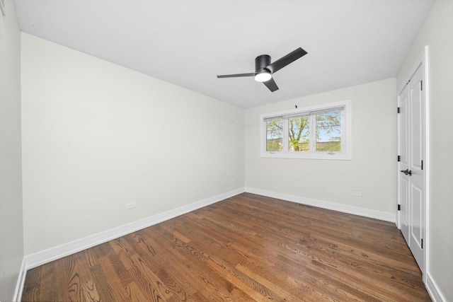 8300 S 79th Ct, Justice, IL 60458 - unfurnished bedroom featuring baseboards, dark wood finished floors, and a ceiling fan