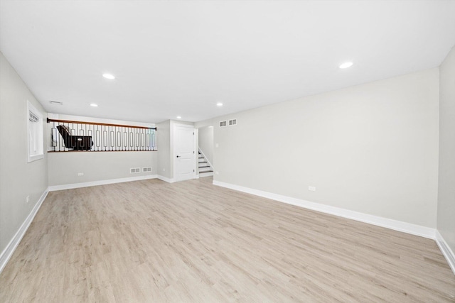 8300 S 79th Ct, Justice, IL 60458 - unfurnished living room with recessed lighting, light wood-type flooring, stairs, and baseboards