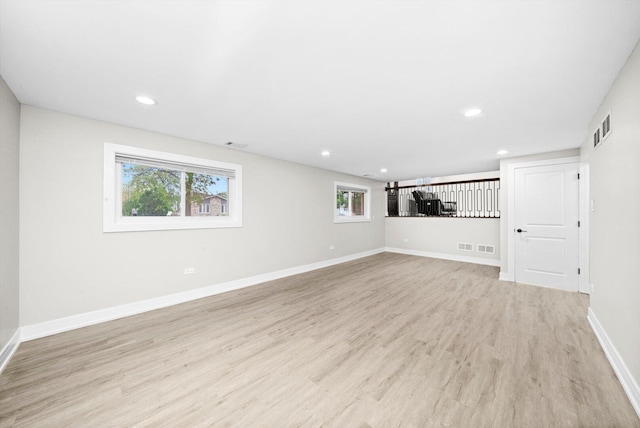 8300 S 79th Ct, Justice, IL 60458 - unfurnished living room with light wood-type flooring, recessed lighting, and baseboards