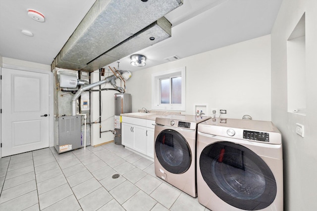 8300 S 79th Ct, Justice, IL 60458 - washroom with cabinet space, water heater, washer and dryer, light tile patterned floors, and heating unit