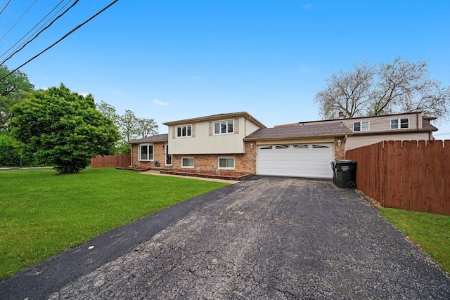 8300 S 79th Ct, Justice, IL 60458 - tri-level home featuring an attached garage, asphalt driveway, and brick siding