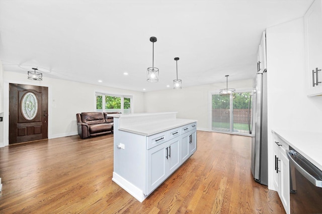 8300 S 79th Ct, Justice, IL 60458 - kitchen with stainless steel appliances, plenty of natural light, light wood-style flooring, white cabinetry, and recessed lighting