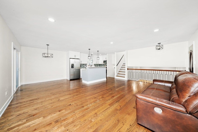 8300 S 79th Ct, Justice, IL 60458 - living room featuring light wood finished floors, recessed lighting, baseboards, and a chandelier