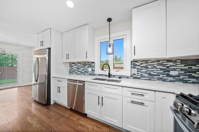 8300 S 79th Ct, Justice, IL 60458 - kitchen with appliances with stainless steel finishes, a sink, light countertops, tasteful backsplash, and recessed lighting