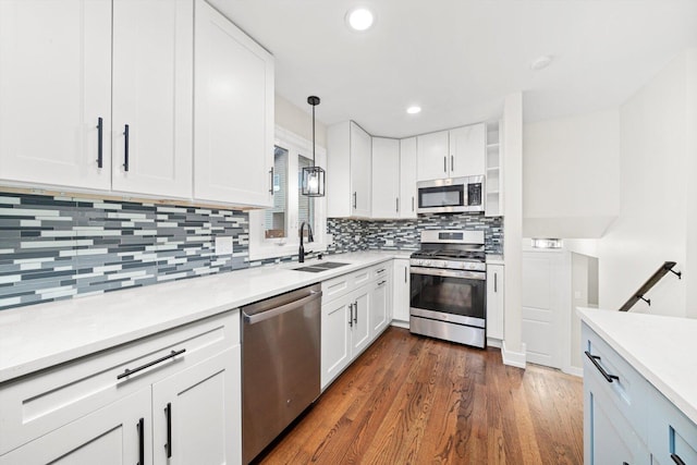 8300 S 79th Ct, Justice, IL 60458 - kitchen with stainless steel appliances, a sink, decorative backsplash, white cabinets, and recessed lighting