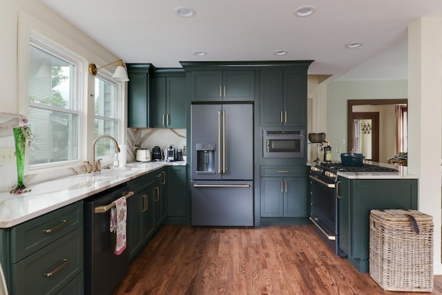 2013 E Taylor St, Bloomington, IL 61701 - kitchen featuring appliances with stainless steel finishes, a sink, dark wood-style floors, recessed lighting, and light stone counters