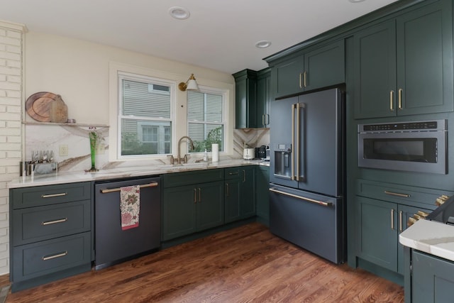 2013 E Taylor St, Bloomington, IL 61701 - kitchen with dishwashing machine, high end fridge, a sink, dark wood-type flooring, and backsplash