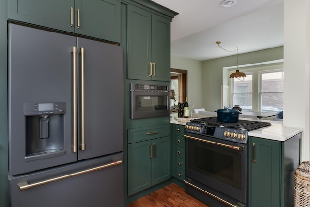 2013 E Taylor St, Bloomington, IL 61701 - kitchen featuring high quality fridge, range with gas stovetop, green cabinetry, light countertops, and dark wood finished floors