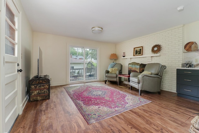 2013 E Taylor St, Bloomington, IL 61701 - living area with wood finished floors and brick wall