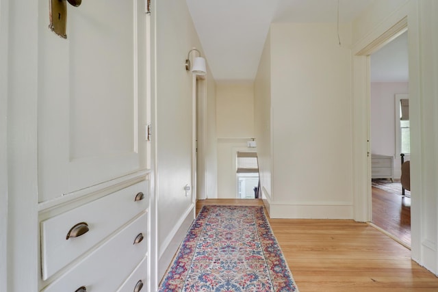 2013 E Taylor St, Bloomington, IL 61701 - hallway with light wood-style floors and baseboards
