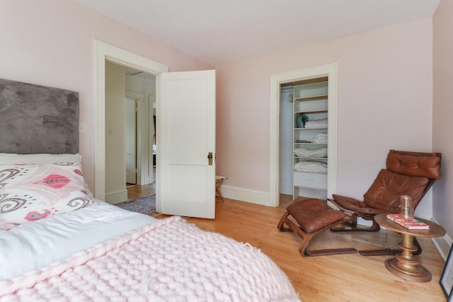 2013 E Taylor St, Bloomington, IL 61701 - bedroom with light wood-style floors, a closet, and baseboards