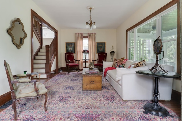 2013 E Taylor St, Bloomington, IL 61701 - living room featuring stairs, wood finished floors, and baseboards