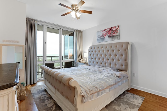 1629 S Prairie Ave Unit 1503, Chicago, IL 60616 - bedroom with access to outside, wood finished floors, baseboards, and a ceiling fan