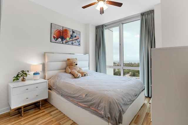 1629 S Prairie Ave Unit 1503, Chicago, IL 60616 - bedroom featuring light wood-style floors and a ceiling fan