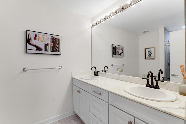 1629 S Prairie Ave Unit 1503, Chicago, IL 60616 - bathroom with double vanity and baseboards