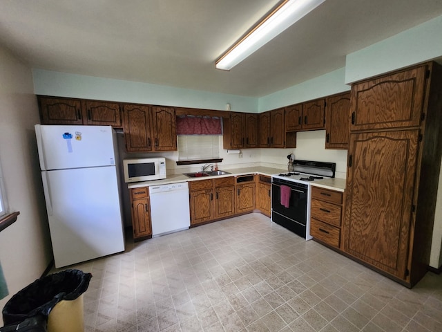 845 Muskegon Ave, Calumet City, IL 60409 - kitchen featuring white appliances, a sink, light countertops, and light floors