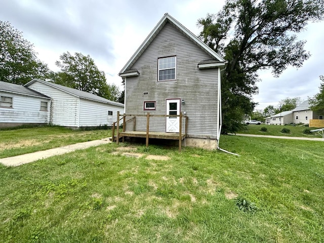 116 W 13th St, Kewanee, IL 61443 - back of property featuring a lawn and a deck