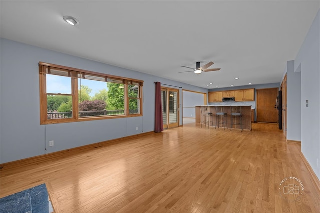 10N738 Prairie Xing, Elgin, IL 60124 - unfurnished living room featuring light wood-type flooring, a ceiling fan, baseboards, recessed lighting, and bar