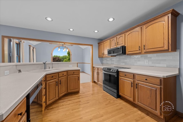 10N738 Prairie Xing, Elgin, IL 60124 - kitchen with range with electric cooktop, stainless steel microwave, a sink, light wood-style flooring, and recessed lighting