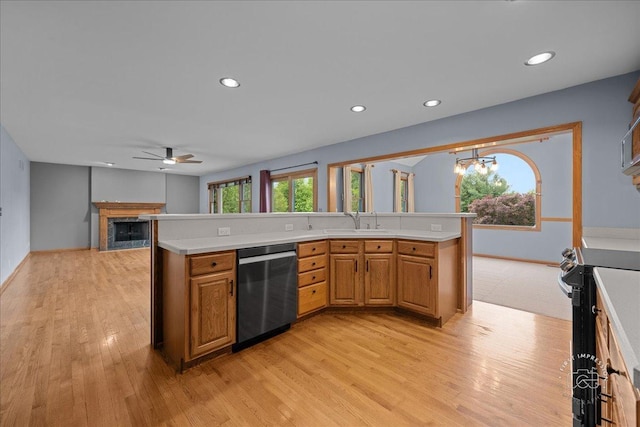 10N738 Prairie Xing, Elgin, IL 60124 - kitchen featuring stainless steel appliances, light countertops, a ceiling fan, a chandelier, and a fireplace