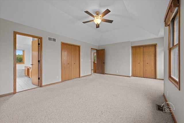 10N738 Prairie Xing, Elgin, IL 60124 - unfurnished bedroom featuring light colored carpet, multiple windows, baseboards, lofted ceiling, and connected bathroom