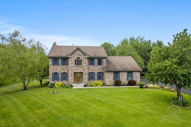 10N738 Prairie Xing, Elgin, IL 60124 - colonial-style house with a front yard and a chimney