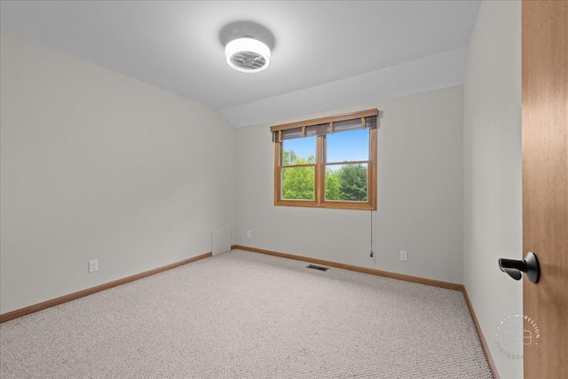 10N738 Prairie Xing, Elgin, IL 60124 - spare room with lofted ceiling, carpet floors, and baseboards