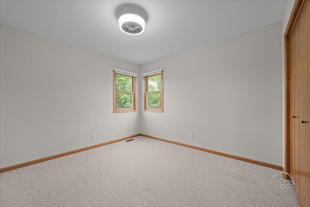10N738 Prairie Xing, Elgin, IL 60124 - unfurnished bedroom featuring carpet flooring, a closet, and baseboards