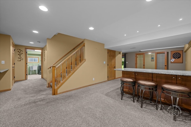10N738 Prairie Xing, Elgin, IL 60124 - kitchen with light colored carpet, recessed lighting, baseboards, and a breakfast bar
