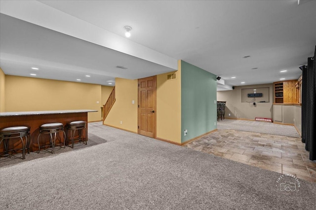10N738 Prairie Xing, Elgin, IL 60124 - finished below grade area with a bar, stairs, carpet, baseboards, and recessed lighting