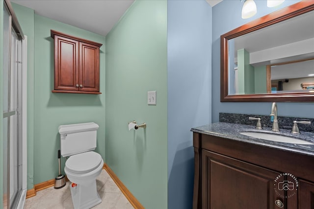 10N738 Prairie Xing, Elgin, IL 60124 - bathroom with toilet, vanity, baseboards, tile patterned floors, and a shower with door
