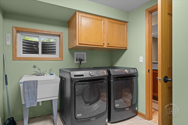 10N738 Prairie Xing, Elgin, IL 60124 - laundry area featuring washer and clothes dryer, cabinet space, light tile patterned floors, and baseboards