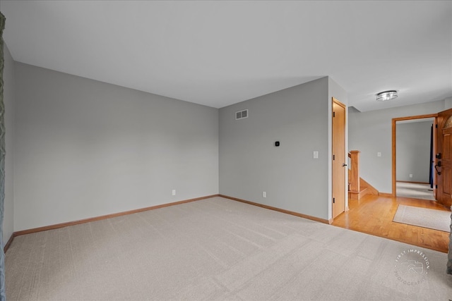10N738 Prairie Xing, Elgin, IL 60124 - empty room with stairway, baseboards, and light colored carpet