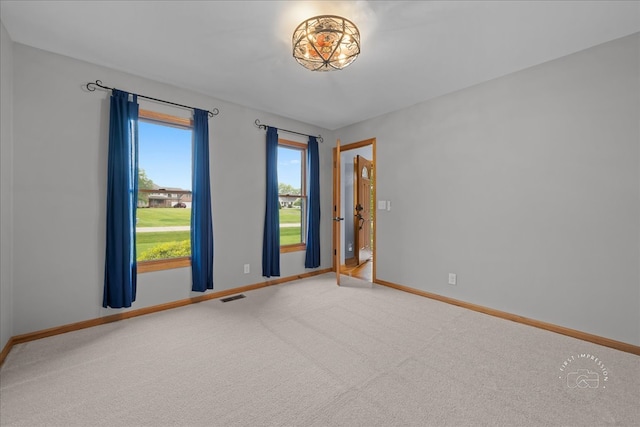 10N738 Prairie Xing, Elgin, IL 60124 - spare room featuring baseboards and carpet
