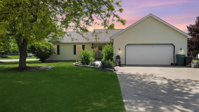 223 W Anderes Cir, Dalzell, IL 61320 - single story home featuring a garage, concrete driveway, a front lawn, and roof with shingles