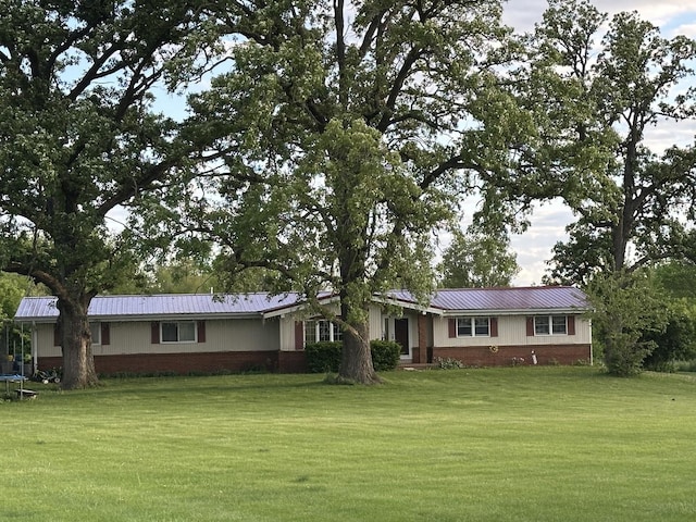 9669 Garden Plain Rd, Morrison, IL 61270 - ranch-style home with a front yard, metal roof, and brick siding